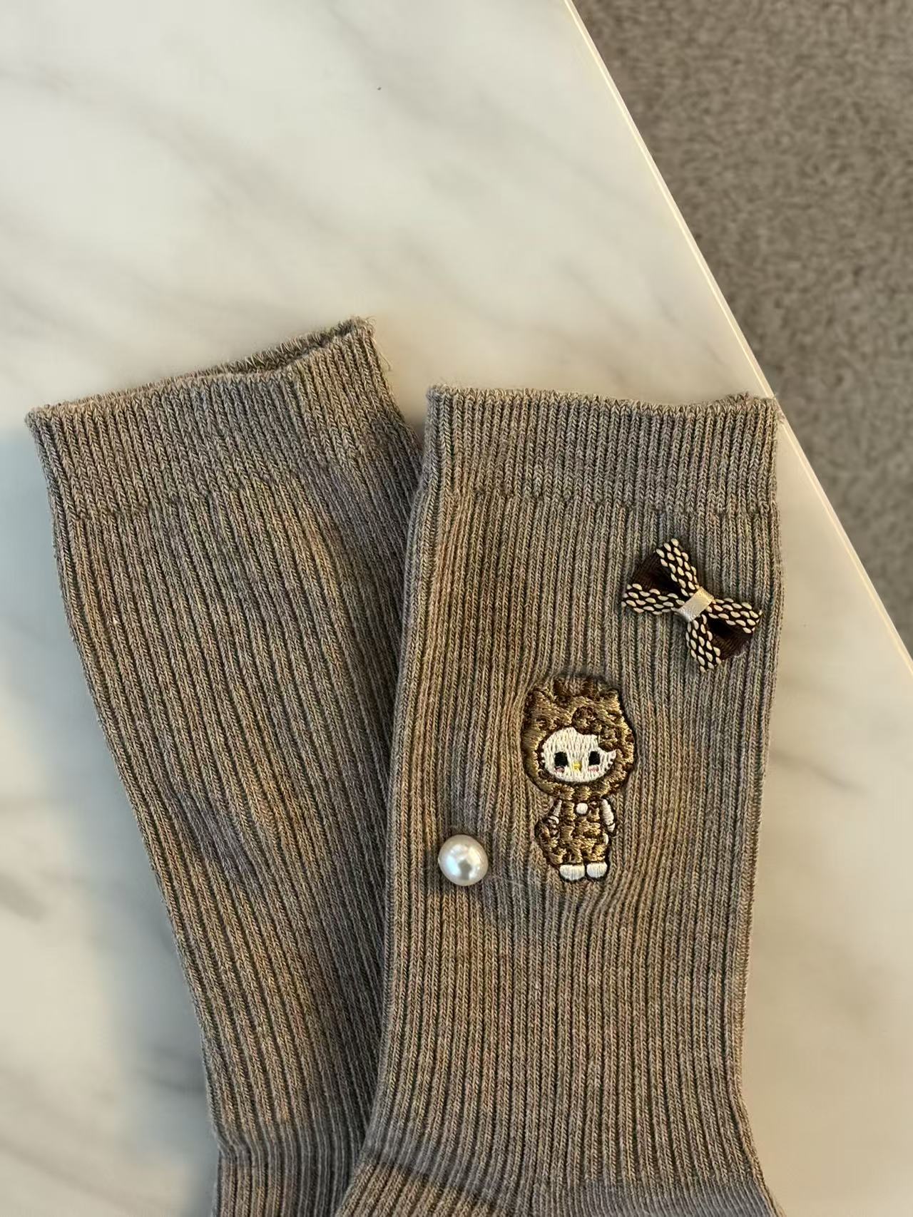 Hello Kitty® Leopard Muse Socks- Brown